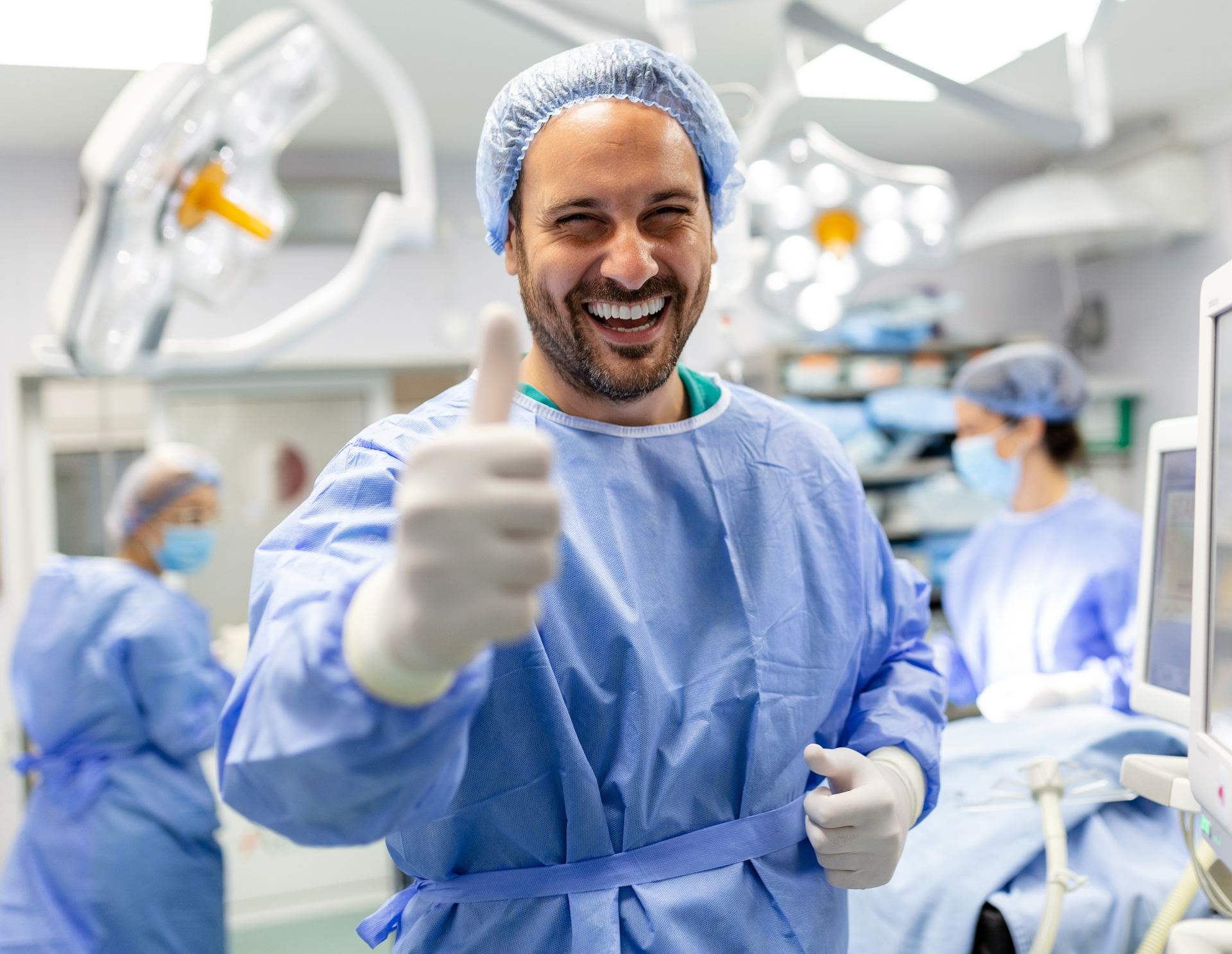 Smiling surgeon in operating room